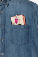 Folded handkerchief inside of someone's pocket.