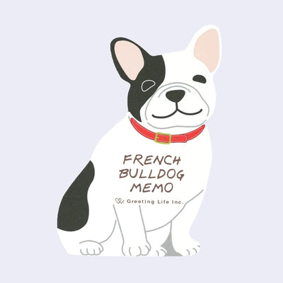Die cut memo pad of a cartoon French Bulldog, white with black spots and a red collar.