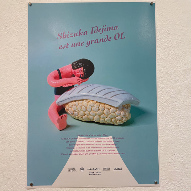 Faux movie poster for "Shizuka Idejima is a BIG OL" featuring posed vinyl figure of a woman leaning over a giant piece of blue sushi.