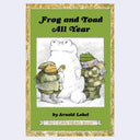 Children's book cover for 'Frog and Toad All Year' by Arnold Lobel, featuring a green cover with an ornate gold border and an illustration of two frogs helping a snowman.