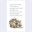 A children's book page featuring a printed story about a frog helping a toad, with black text on a white page and a small illustrated scene at the bottom showing the characters in winter clothing.
