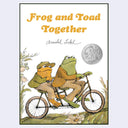 Book cover for 'Frog and Toad Together' by Arnold Lobel, showing two frogs riding a tandem bicycle on a grassy path, with the title in orange text at the top and a silver Medal badge on the right.
