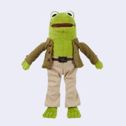 Plush doll of Frog from Frog and Toad, wearing detailed clothing such as a jacket with bead buttons, striped pants and a pleather belt. 