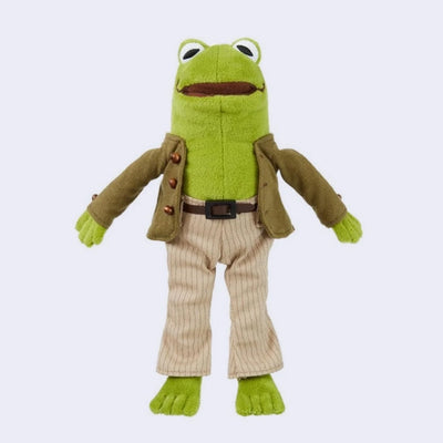 Plush doll of Frog from Frog and Toad, wearing detailed clothing such as a jacket with bead buttons, striped pants and a pleather belt. 