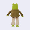 Plush doll of Frog from Frog and Toad, wearing detailed clothing such as a jacket with bead buttons, striped pants and a pleather belt. 