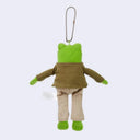 Plush toy frog character with a green jacket and brown outfit on a white background