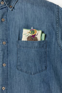 Folded handkerchief inside of someones' pocket.