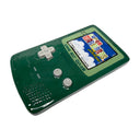 Ceramic sculpture of a green Gameboy Color, with the load screen of Super Mario Bros. Deluxe on it.