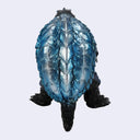A blue and black turtle figurine shown from the back against a light gray background.