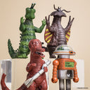 Four colorful toy figures on a beige background