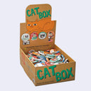 Box of 'Cat Box' with colorful cat themed buttons on a white background