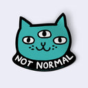Teal cat face sticker with 'Not Normal' text on a light gray background