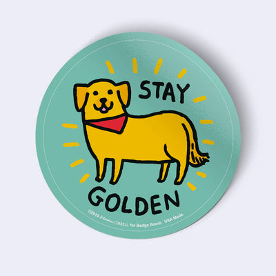 Round sticker with a yellow dog illustration and text 'Stay Golden' on a light blue background