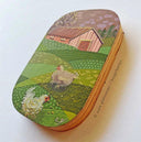 Painting on a wooden panel with rounded edges of 2 fluffy chickens on a farm with rolling green hills and a pink barn house.