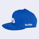Blue cap with a logo and text on a light gray background
