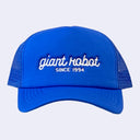 Bright blue colored hat with "giant robot" written along the front in white cursive, and "since 1994" written below in plain capital font.