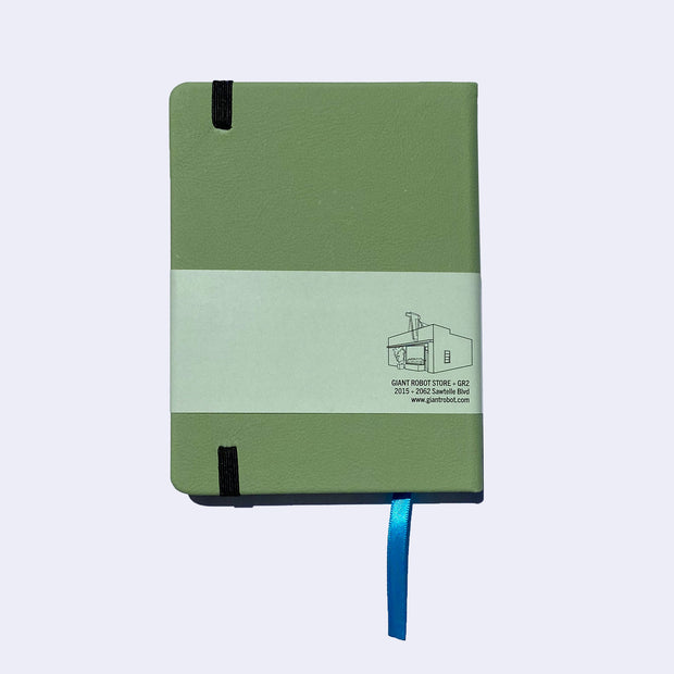 Backside of a sage green pleather covered journal with an elastic closure and a shiny blue page marking ribbon.