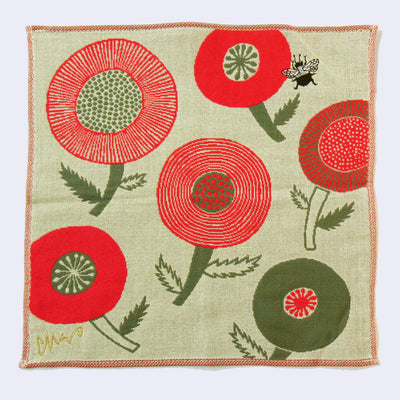 Greenish beige square handkerchief with a small black bumblebee flying over large rounded red and green flowers.