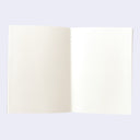 An open blank notebook with two blank cream-colored pages, bound with a white string, shown against a light lavender background.