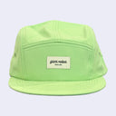 A lime green 5-panel camp cap with a white rectangular patch on the front that reads 'giant robot SINCE 1994', shown against a light lavender background.