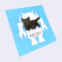 A black cat-shaped enamel pin with silver outlines, displayed on a light blue backing card featuring a white robot silhouette and the text for Giant Robot.