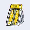 An enamel pin shaped like a package of Tamago Sando.