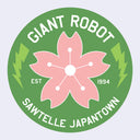 Logo with pink flower and text 'Giant Robot Sawtelle Japantown' on a green circle