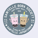 Circular sticker with boba drink characters holding hands and text on a light blue background