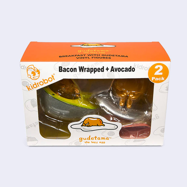 Packaging for Breakfast Gudetama 2 pack of vinyl figures, rectangular box with an orange top and plastic display window to see figures inside.