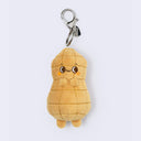 Plush keychain shaped like a cartoon peanut.