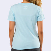 Back of light blue t-shirt with a logo in the upper center that reads "tokidoki x Hello Kitty and Friends" in white.
