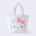 Fluffy white faux fur handle bag with Hello Kitty's face on the front, she has 3D fluffy ears, a pink box and kawaii eyes.