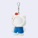 Plush keychain of Hello Kitty with a red bow and blue dress, seen from the back where a mirror is embedded in the back of her head.