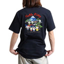 Person wearing a navy blue t-shirt with Hello Kitty and friends graphic on the back