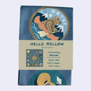 Folded blue fabric bandana of a bear riding in a kayak with text that reads "kayak" overhead