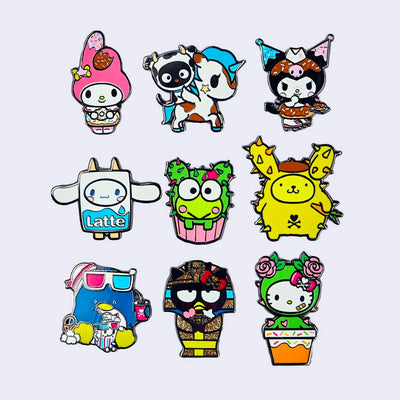 9 differently designed enamel pins of Sanrio characters dressed as tokidoki characters. Options are My Melody, Chococat, Kuromi, Cinnamoroll, Keroppi, Pompompurin, Tuxedosam, Badtz-maru or Hello Kitty.