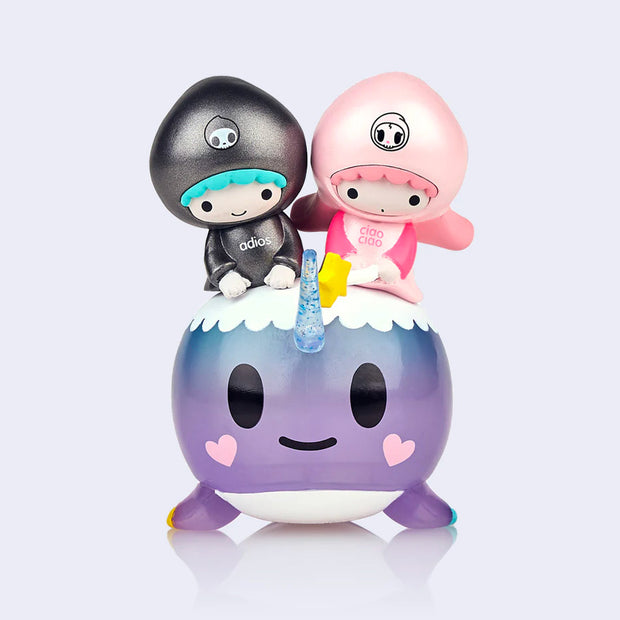 Vinyl figure of Sanrio's Little Twin Stars, a pink haired girl and a blue haired boy, riding atop of a smiling purple narwhal. 