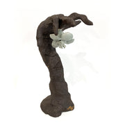 Ceramic sculpture of a brown tree branch with a single white flower.