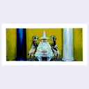 Surreal artwork of a figure in a white robe with goats, set against a yellow and blue background.