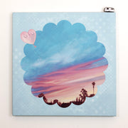 Painting on canvas of a sunset time with a silhouette of the tops of roofs and trees at the bottom. The scene is enclosed in a scalloped border with blue polkadots. 