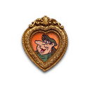A heart-shaped gold brooch featuring a miniature painted portrait of a cartoon character with a long nose, set against a plain white background.