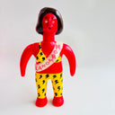 Colorful toy figure with a red face and yellow outfit on a white background