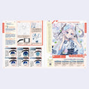 Illustrated book open to a page with anime-style character and art techniques.