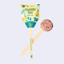 Humble Bee seed pop packaging with a brownish pink plantable disc with seeds within on a stick on a white background