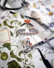 Clear sticker of a cat in a jar with flowers coming up atop.