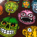 Sticker sheet with 20+ different stickers of monster faces.
