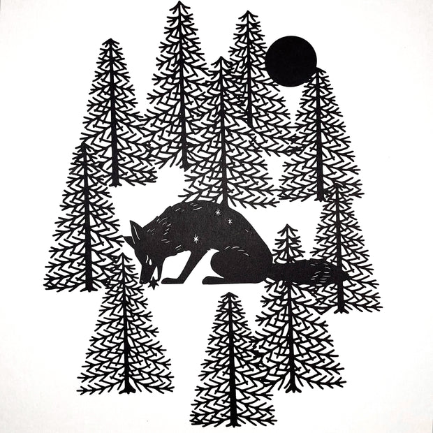 Black paper cutting art of a fox, hunched over and picking up a small star with its mouth. It sheds a small tear and is surrounded by bare pine trees and a full moon.
