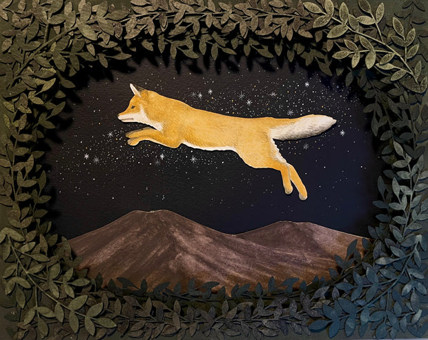 Assembled paper cutting diorama of a fox, jumping over a mountain range and against a starry night sky. It is framed by many cut leaves, revealing the scene.
