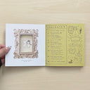 Open 2 page spread from "Cutelife Zine Vol. 2" featuring a scan of a small, framed painting and a table of contents of the featured writings and sections.