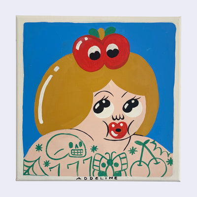 Simple and stylistic painting of a cartoon woman with large red lips pursed together, slightly akin to Betty Boop in art style. She is topless and heavily tattooed but can only be seen from the shoulders up. She looks up at an apple atop her head, which look back at her.